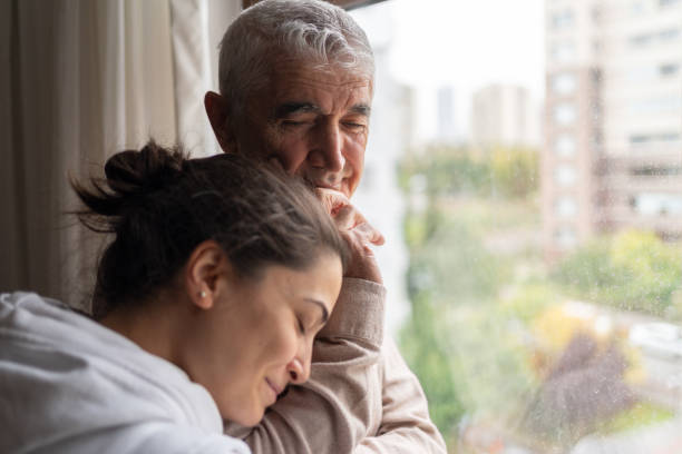 Man-with-daughter-possibly-coping-with-Alzheimer's.