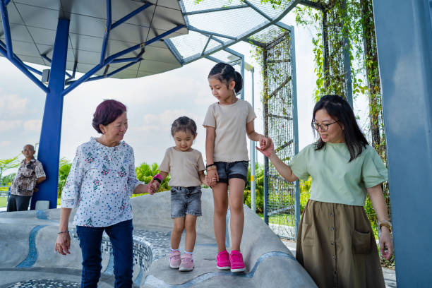 A family is playing and enjoying their time together in public park. Family enjoying their time in public park